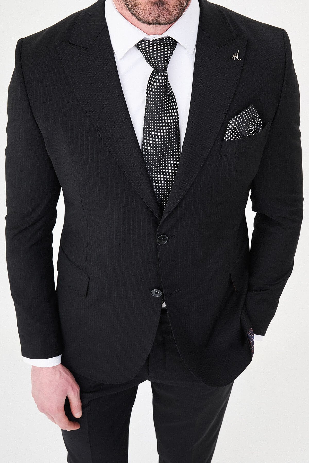 Men's Black Slim Fit Wide Collar Premium Wool Suit, featuring slim-fit tailored jacket, white dress shirt, patterned black tie, and pocket square.