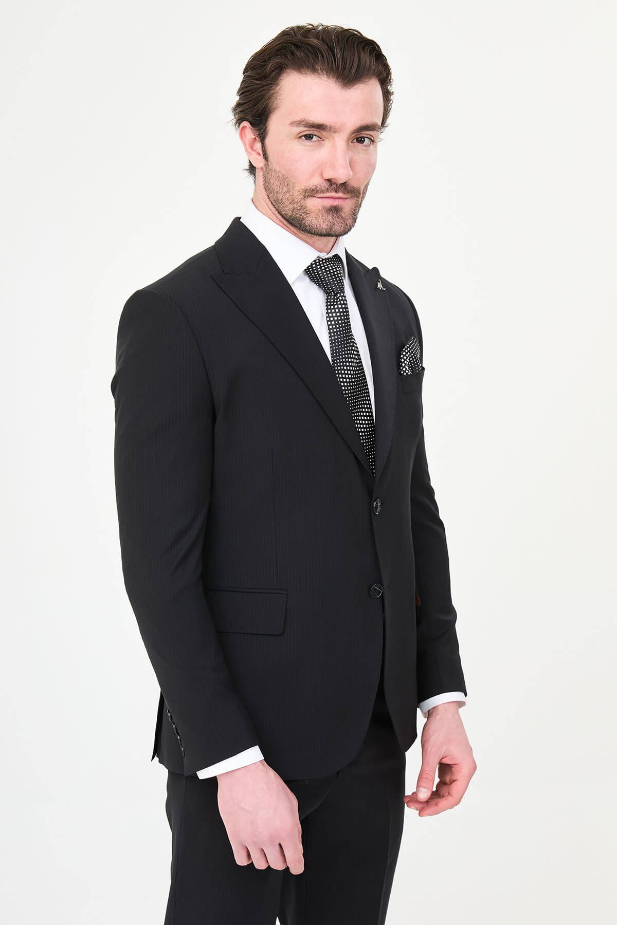 Men's Black Slim Fit Wide Collar Premium Wool Suit, featuring slim-fit tailored jacket, white dress shirt, patterned black tie, and pocket square.