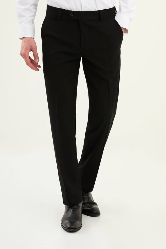 Black slim-fit formal trousers with front pleats, styled with black leather shoes.