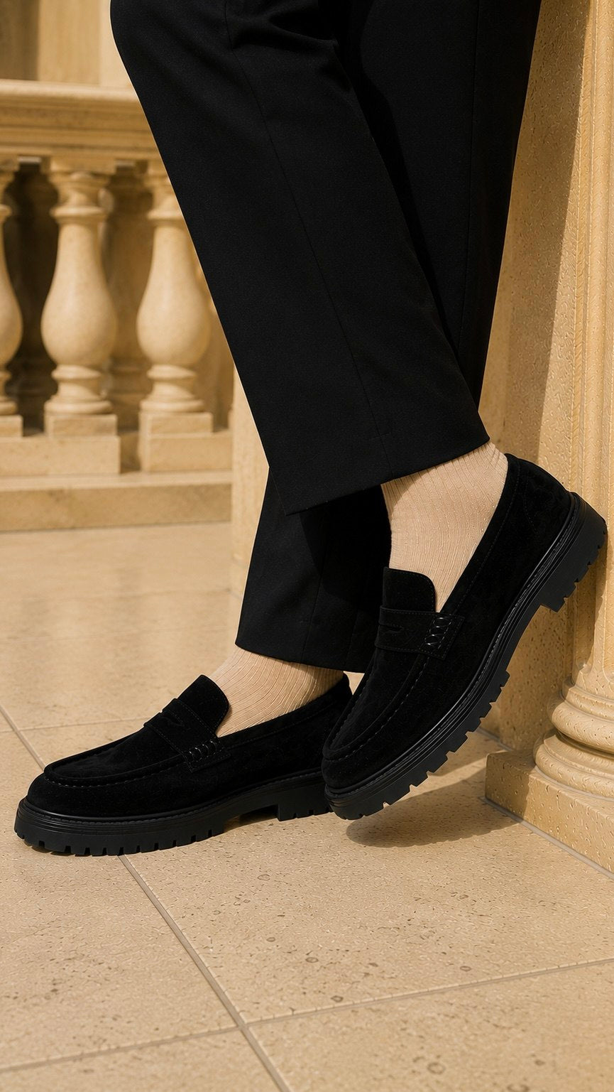 Pair of men's black suede loafers, smart casual slip-on shoes, full view