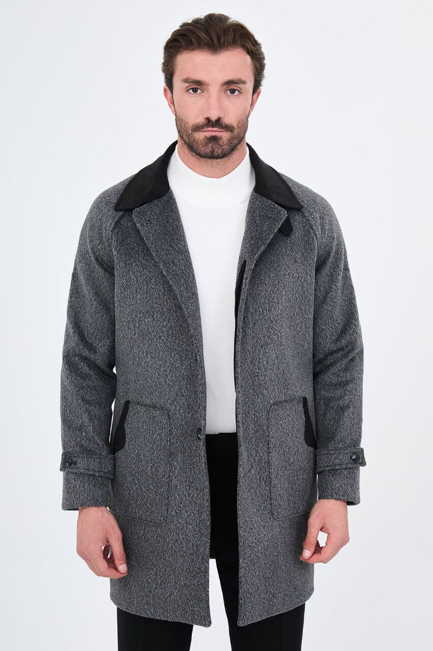 Men's dark grey wool overcoat with stand collar, button-front fastening, and tailored silhouette.