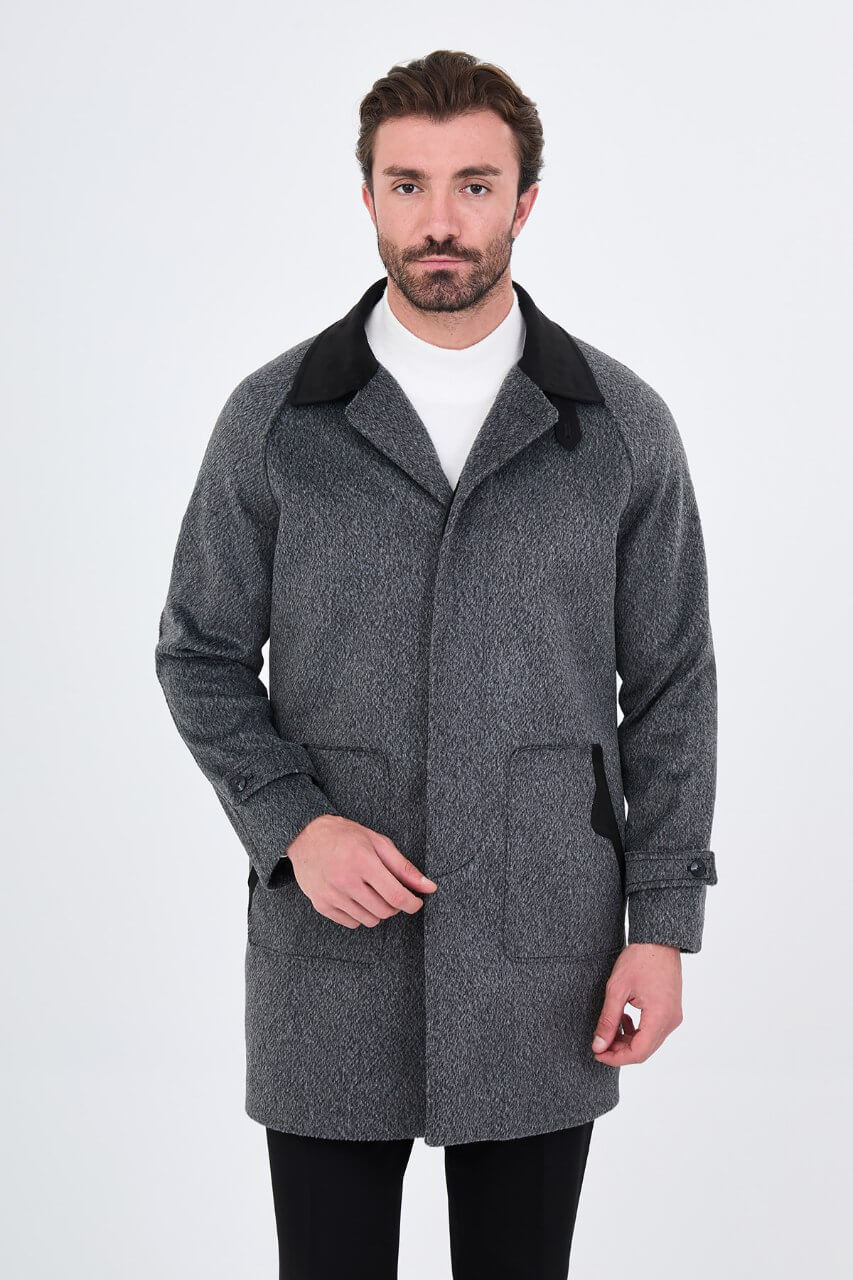 Men's dark grey wool overcoat with stand collar, button-front fastening, and tailored silhouette.