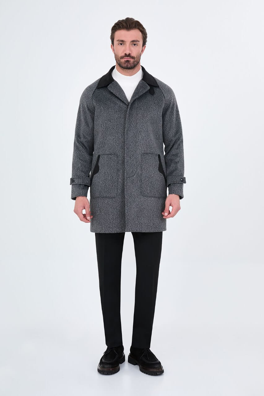 Men's dark grey wool overcoat with stand collar, button-front fastening, and tailored silhouette.