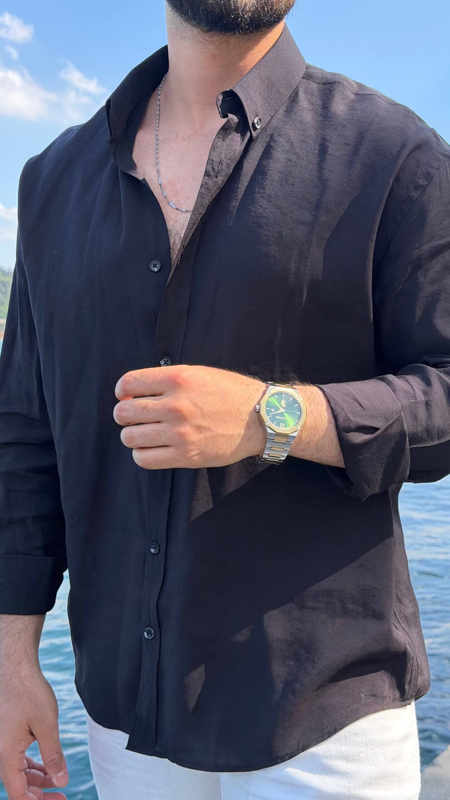 Men's black striped shirt with button front, full-length styling view