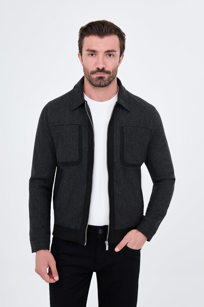 Black wool-blend men's jacket styled with a white T-shirt and black trousers.