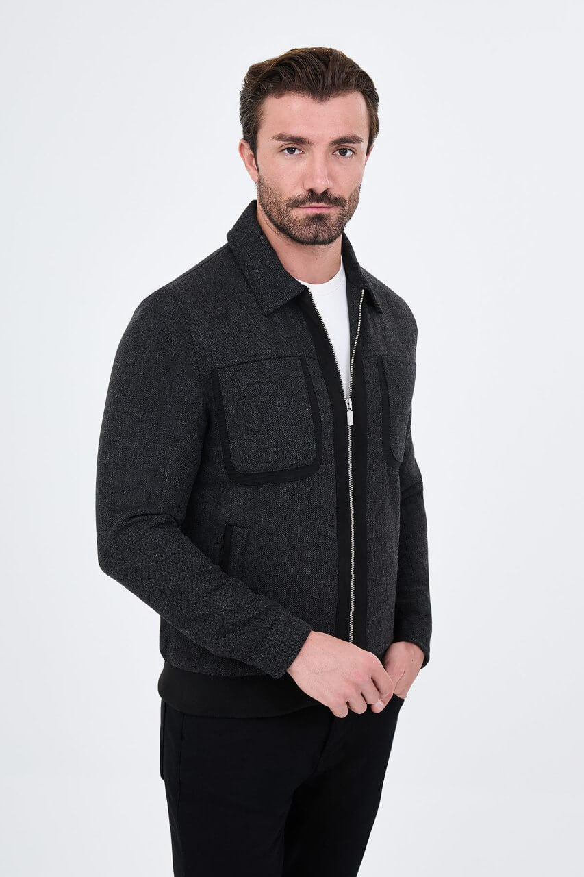 Black wool-blend men's jacket styled with a white T-shirt and black trousers.
