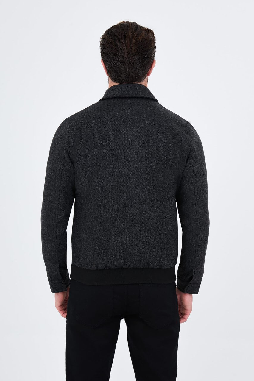 Black wool-blend men's jacket styled with a white T-shirt and black trousers.