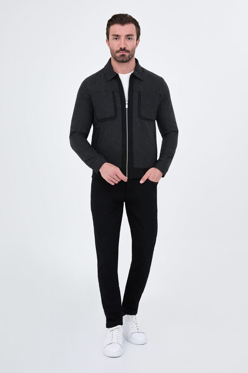 Black wool-blend men's jacket styled with a white T-shirt and black trousers.