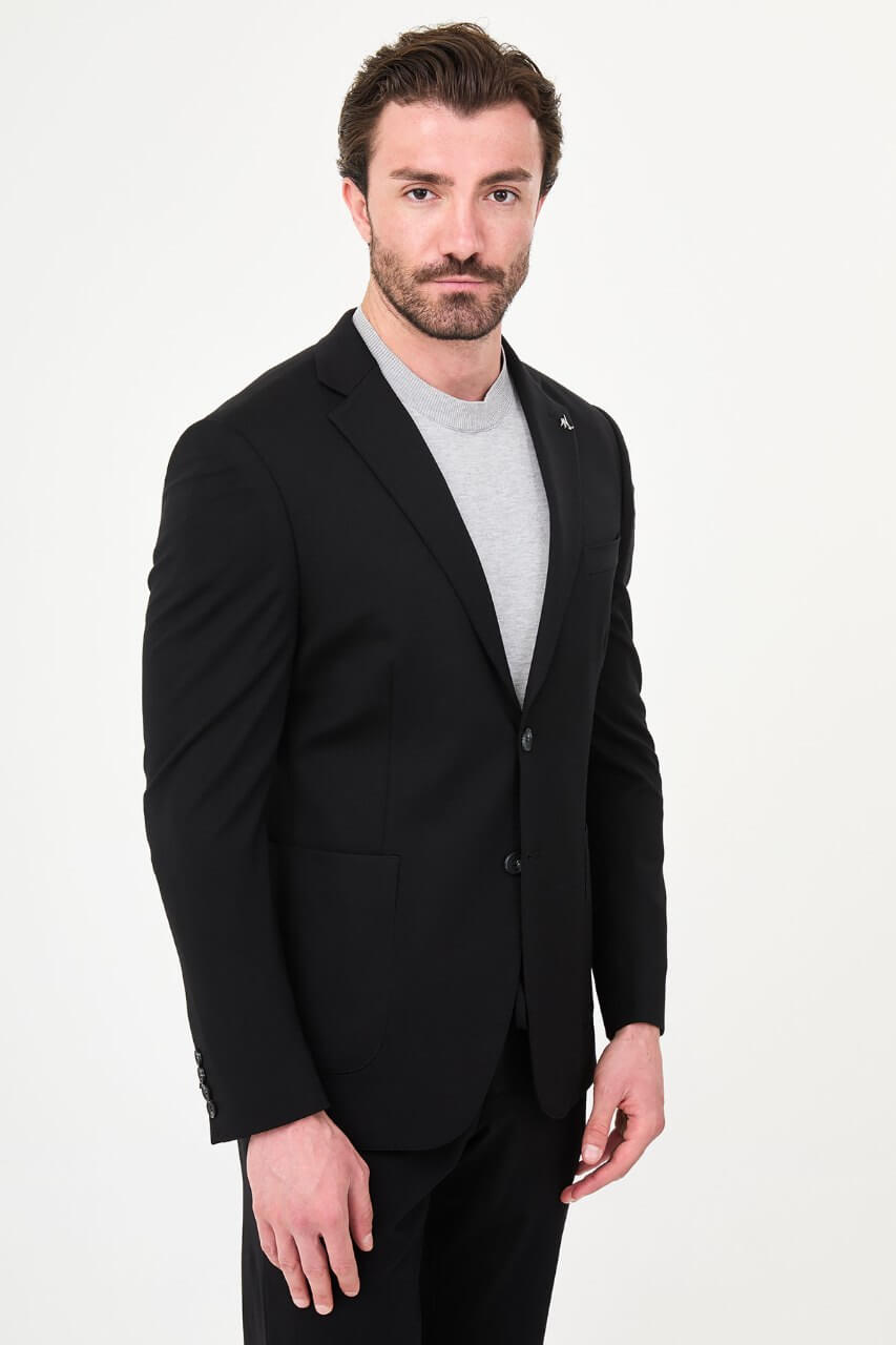 Men's black slim-fit casual suit with a two-button blazer, notch lapels and front patch pockets.