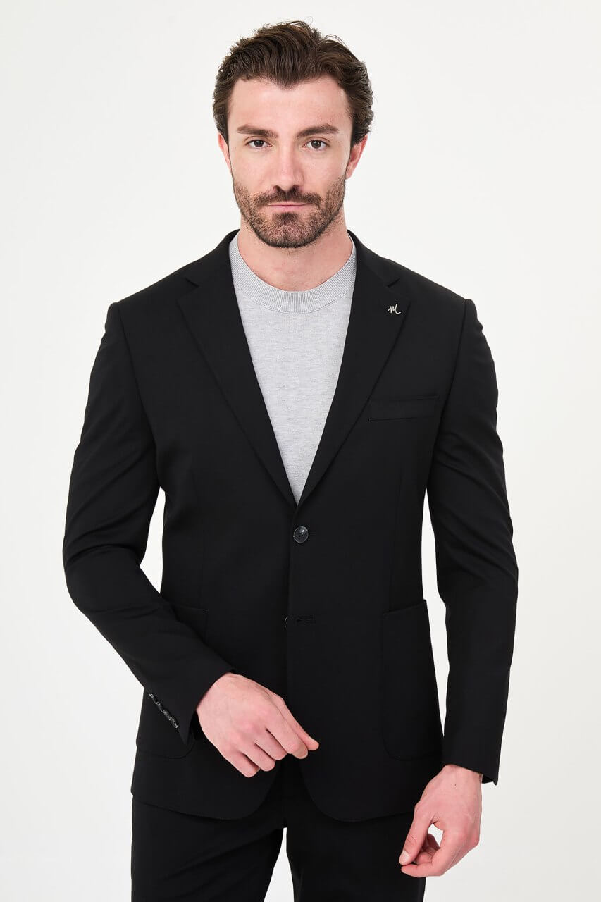 Men's black slim-fit casual suit with a two-button blazer, notch lapels and front patch pockets.