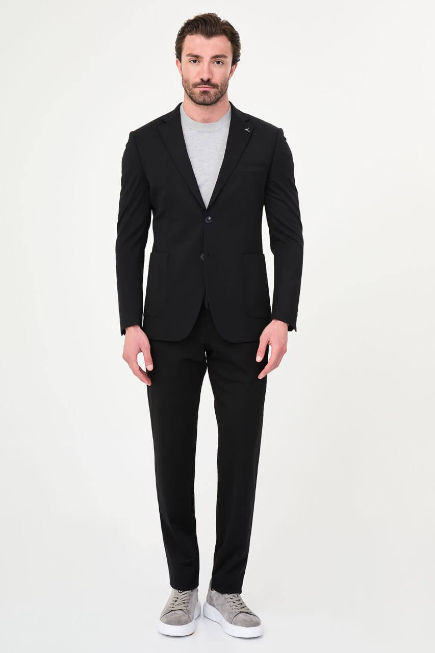 Men's black slim-fit casual suit with a two-button blazer, notch lapels and front patch pockets.