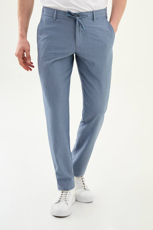 Man wearing blue slim-fit summer trousers