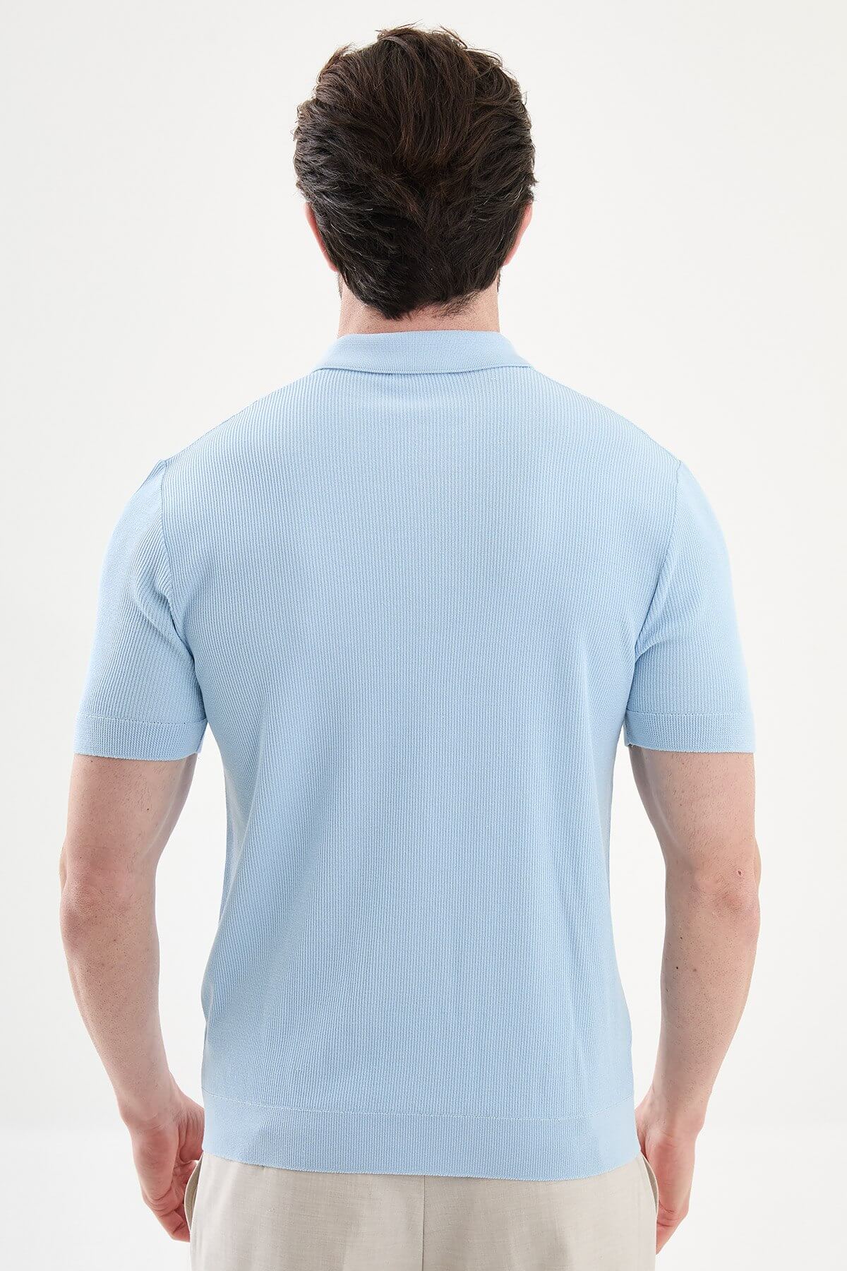 Men’s blue slim-fit knit polo shirt with classic collar, short sleeves, and textured knit finish for summer smart-casual style.