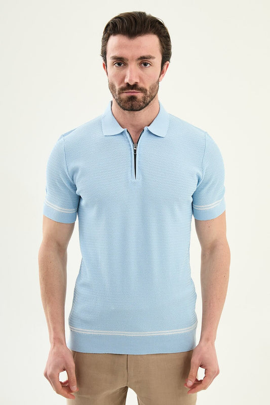Man wearing a blue slim-fit quarter-zip polo T-shirt, short sleeves, standing against a neutral background, styled for summer casual wear.