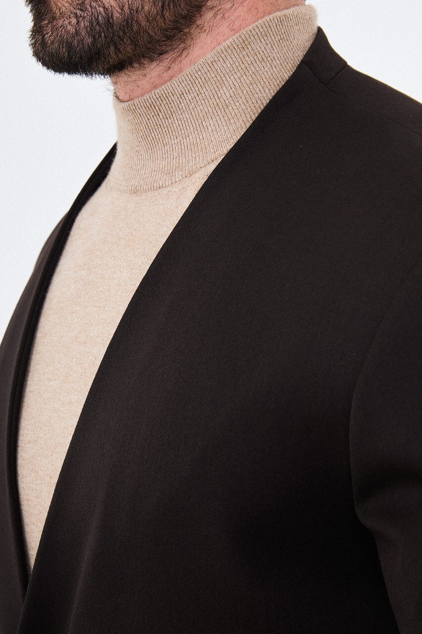 Men's brown slim-fit suit featuring a collarless V-neck jacket and single-button fastening.