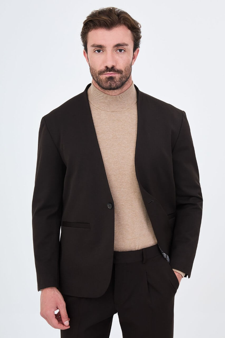 Men's brown slim-fit suit featuring a collarless V-neck jacket and single-button fastening.