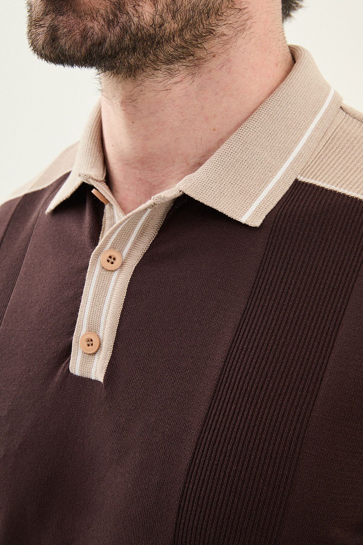 Men’s brown slim-fit knit polo shirt with classic collar, short sleeves, and textured knit finish for summer smart-casual style.