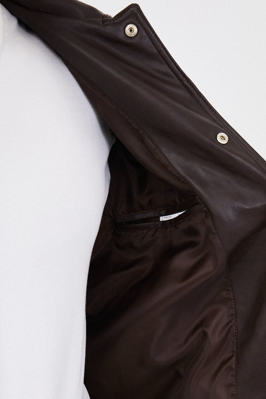 Men's brown faux leather jacket with a classic collar, button-front closure and chest flap pocket.