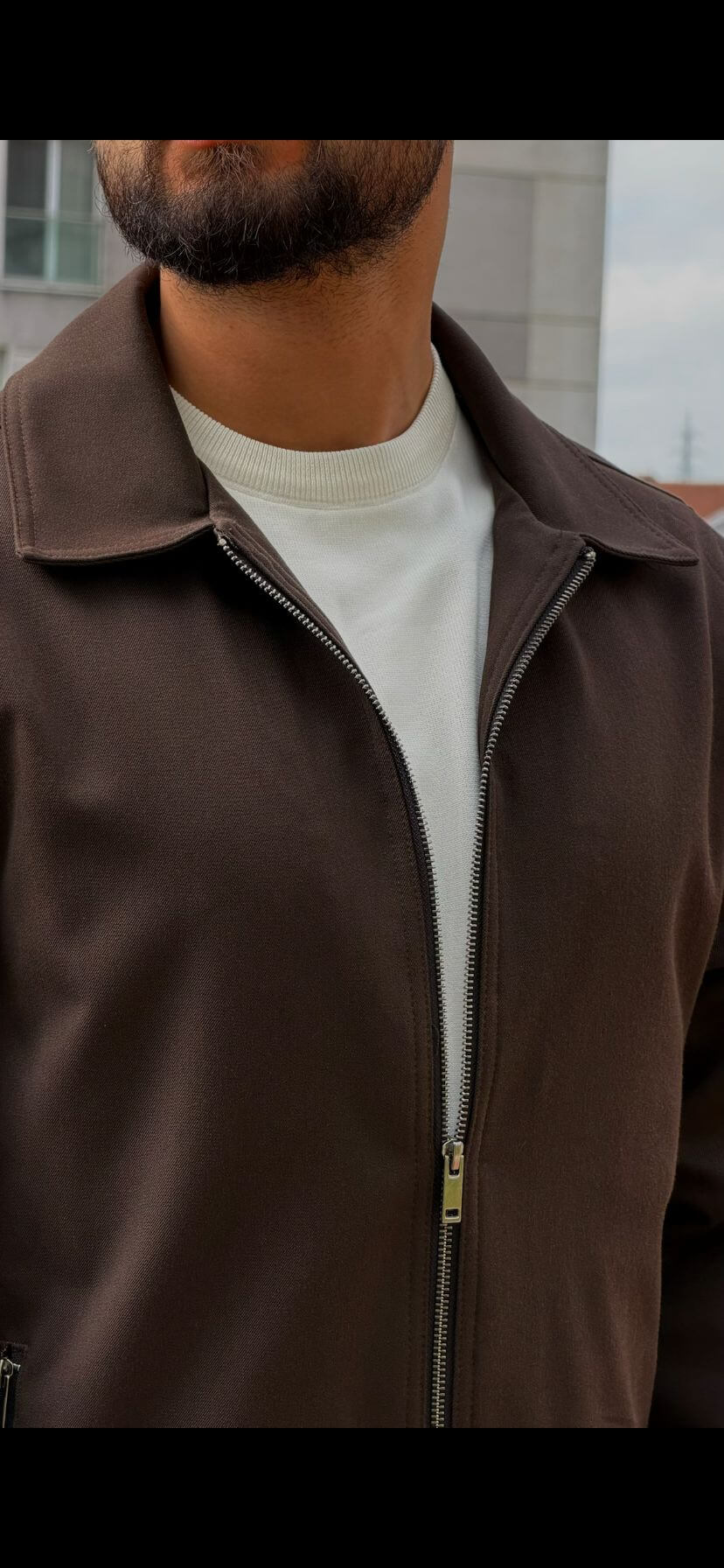 Men’s brown zip-up jacket with tailored fit and minimalist design, smart casual outerwear styled with matching trousers