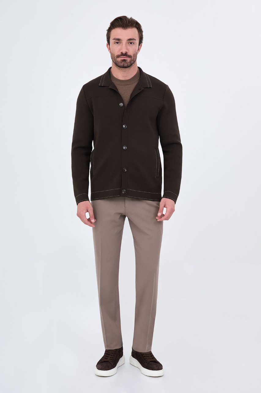 Men’s brown cotton blend knit button-up cardigan styled with trousers for fall winter fashion