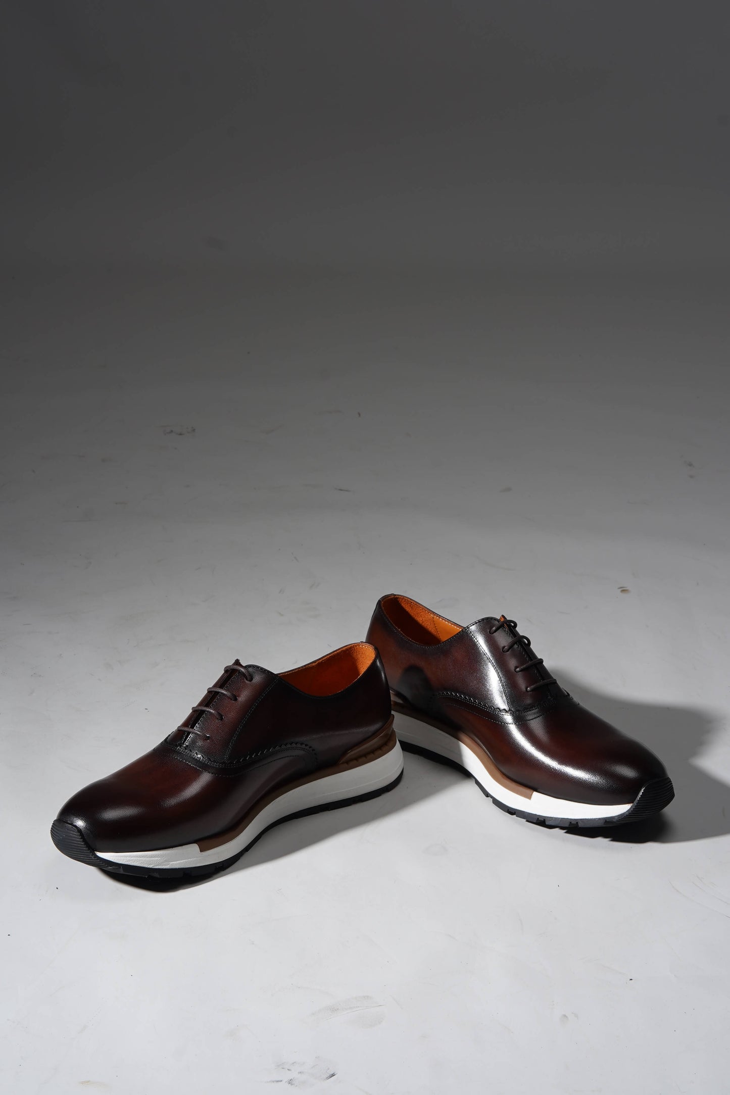 Luxury brown leather sneakers for men with premium design