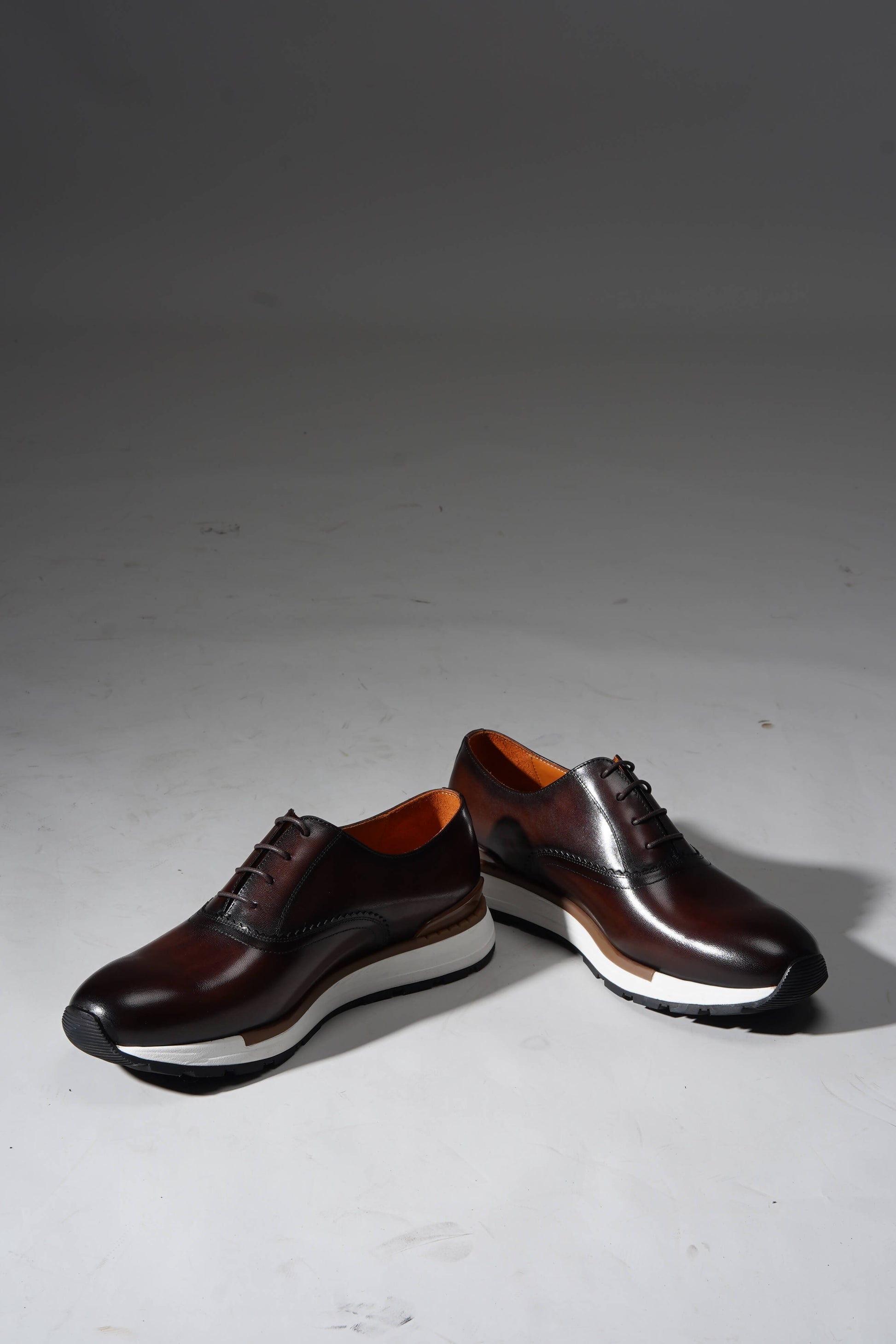 Luxury brown leather sneakers for men with premium design