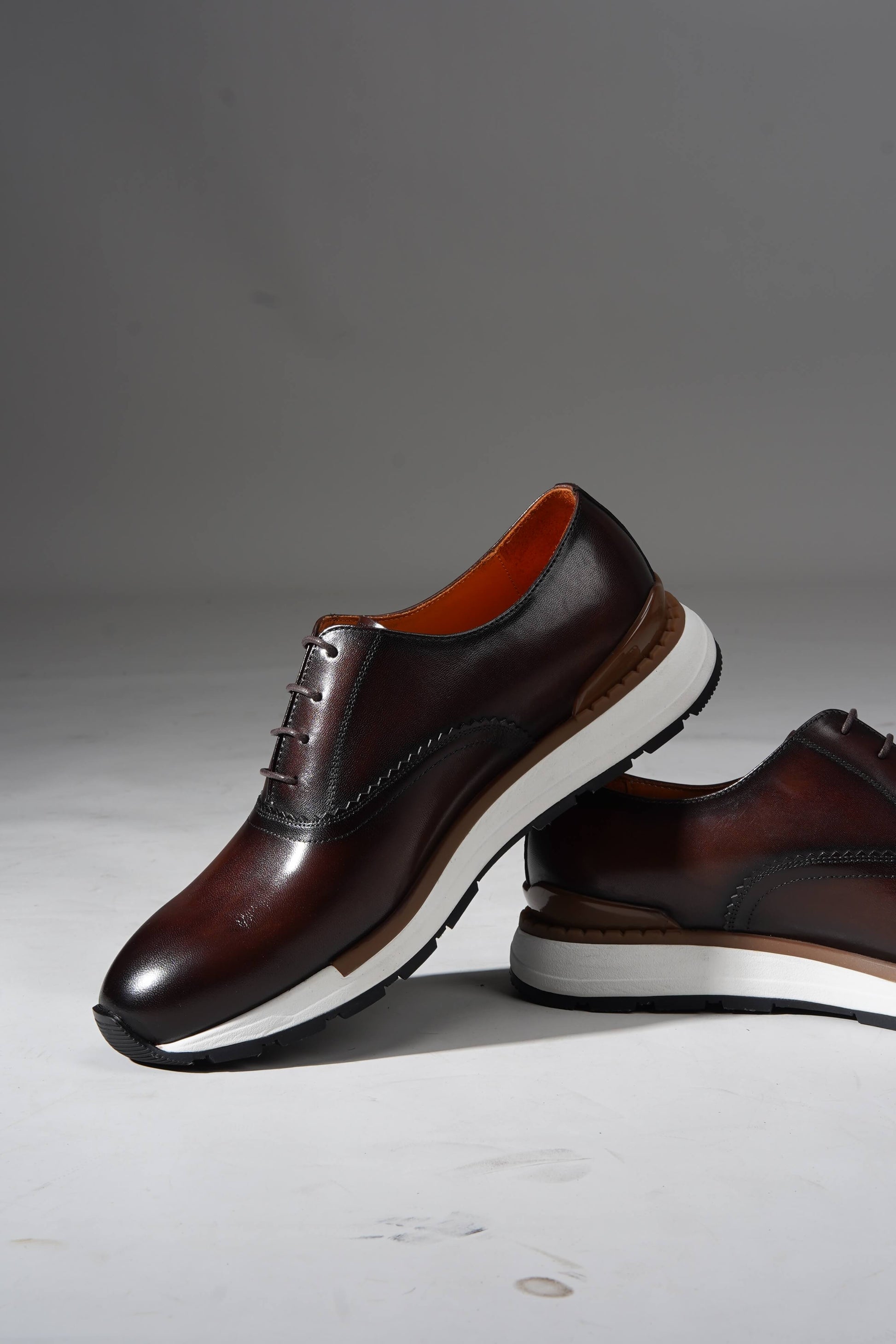 Luxury brown leather sneakers for men with premium design