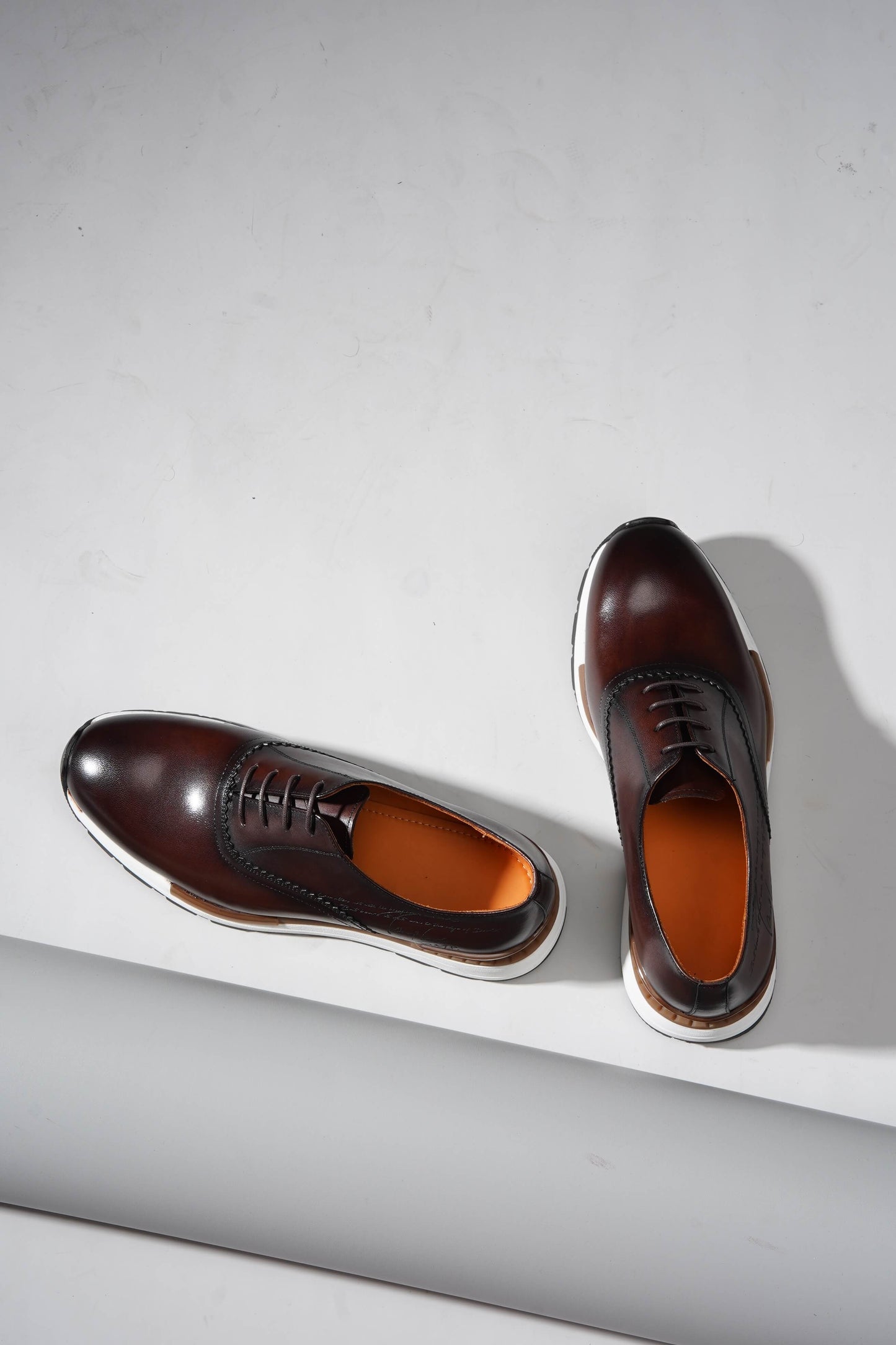 Luxury brown leather sneakers for men with premium design