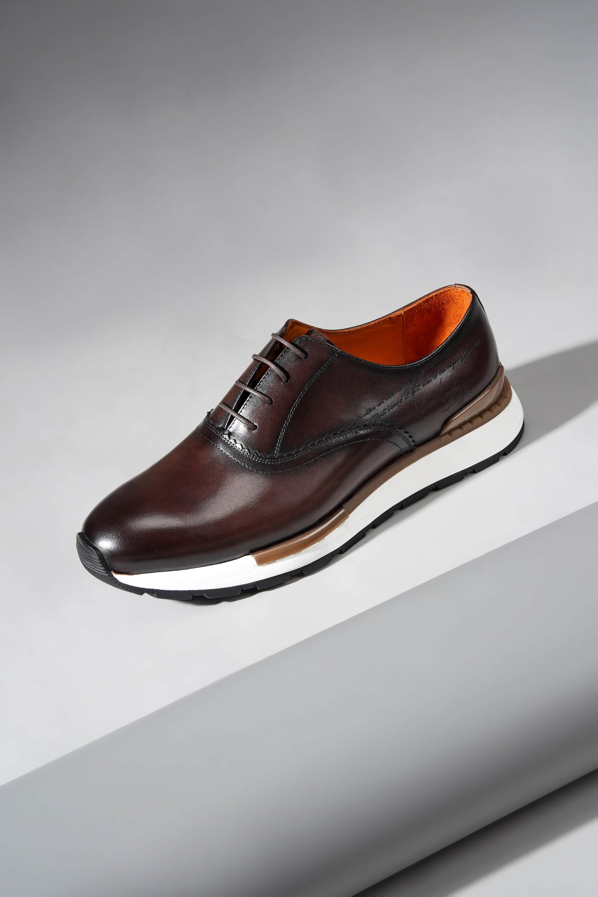 Luxury brown leather sneakers for men with premium design