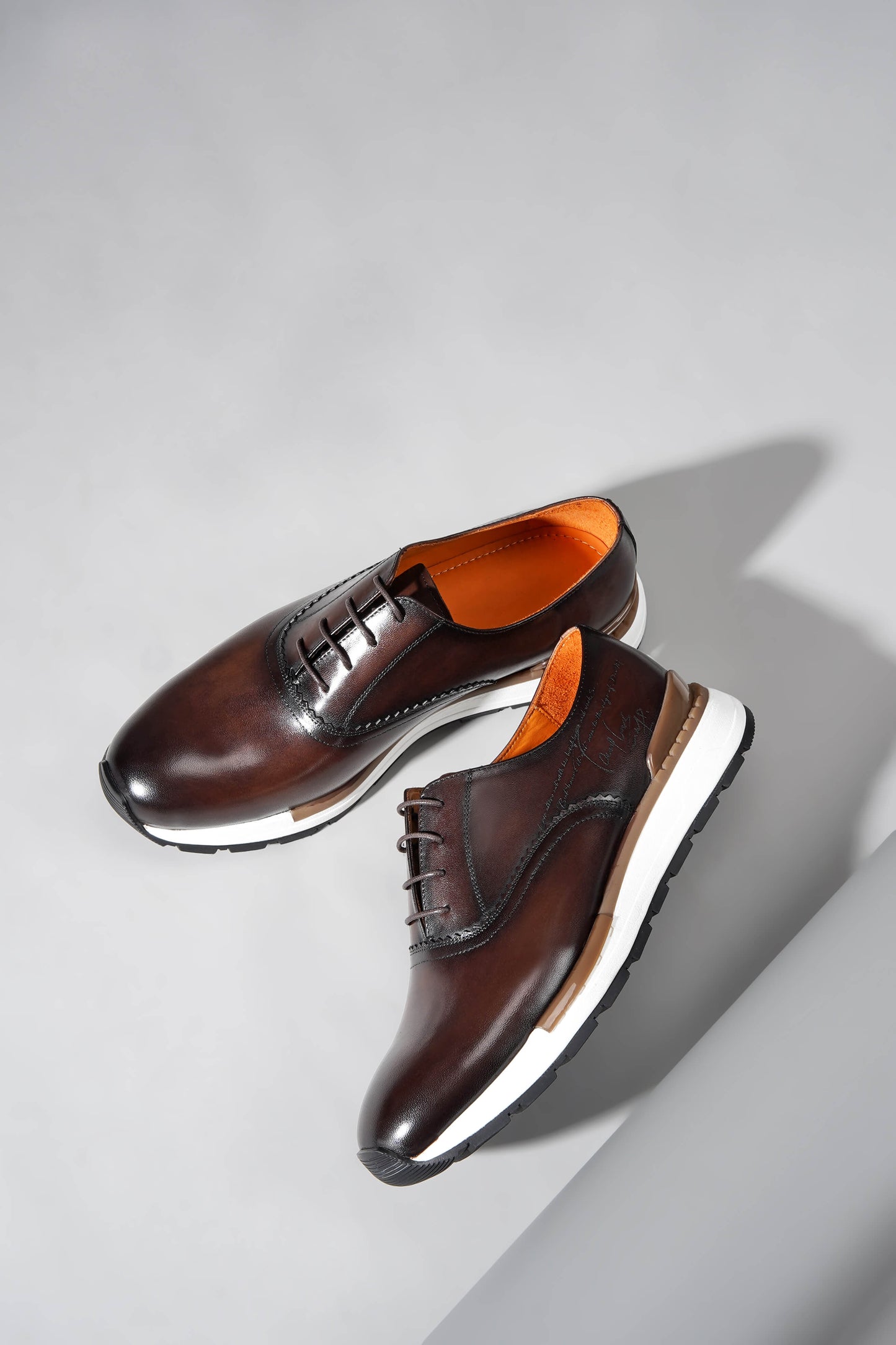 Luxury brown leather sneakers for men with premium design