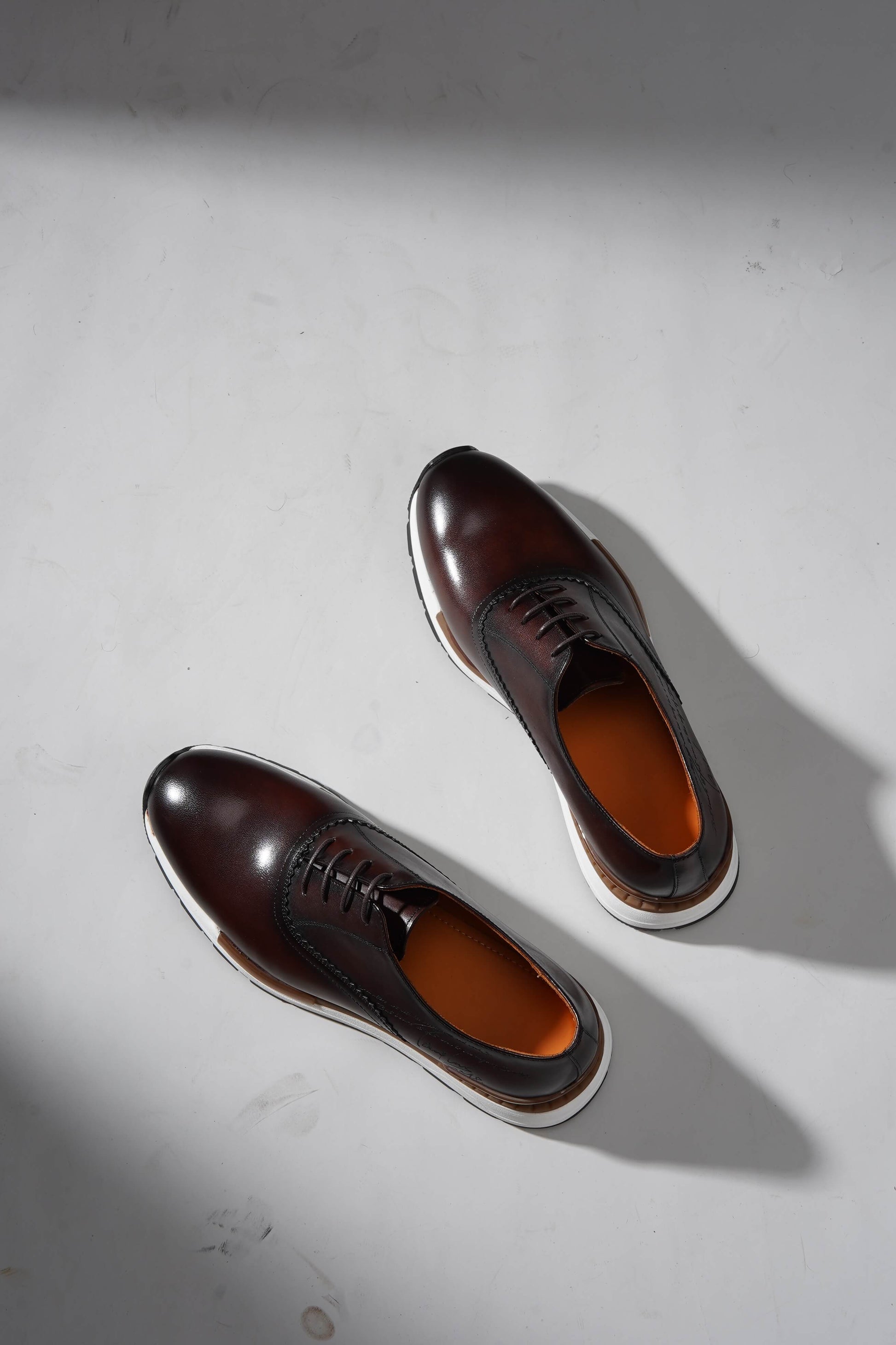 Luxury brown leather sneakers for men with premium design