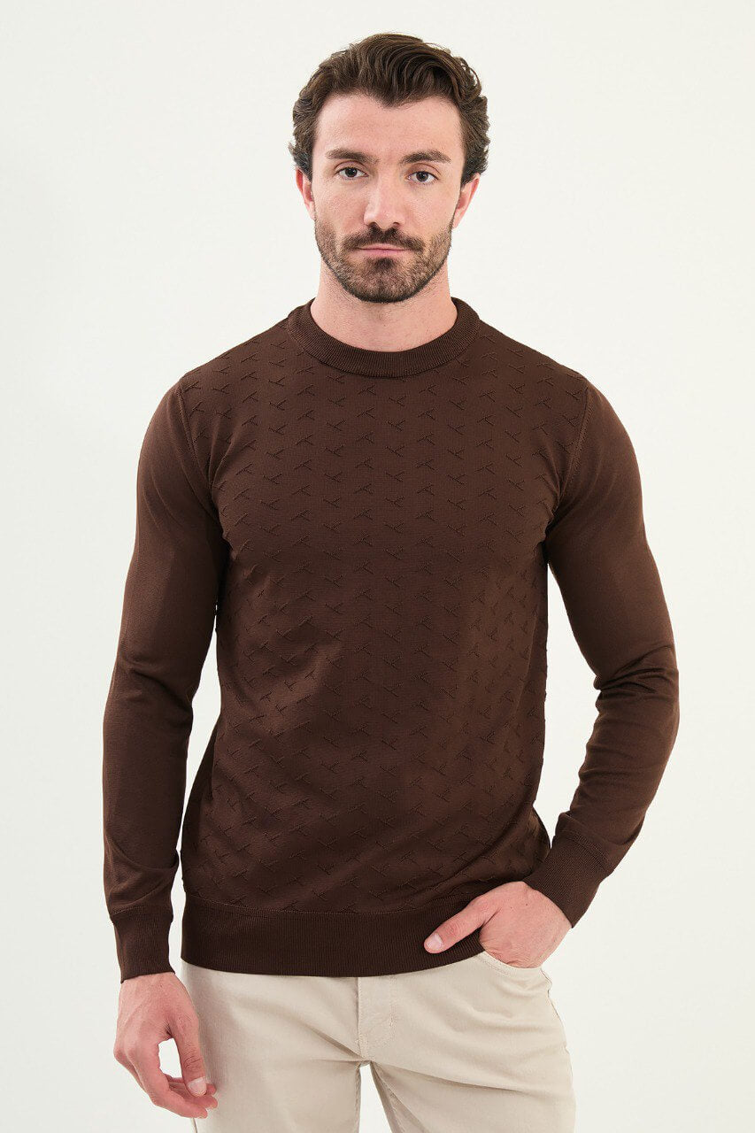 Men’s slim-fit chocolate brown crew-neck sweater with geometric ‘T’ textured knit front panel, cotton-viscose-elastane blend, styled with cream trousers.