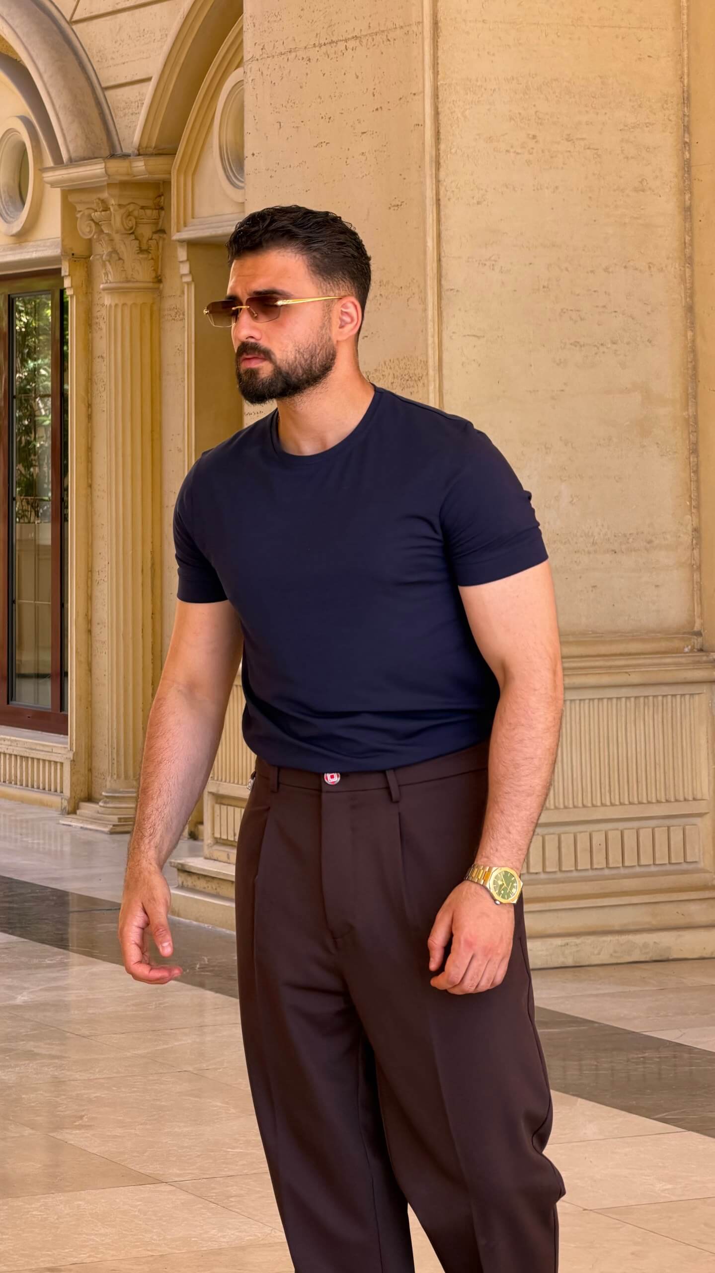 Men's Brown Single Pleated Trousers styled with navy loafers for a smart summer outfit