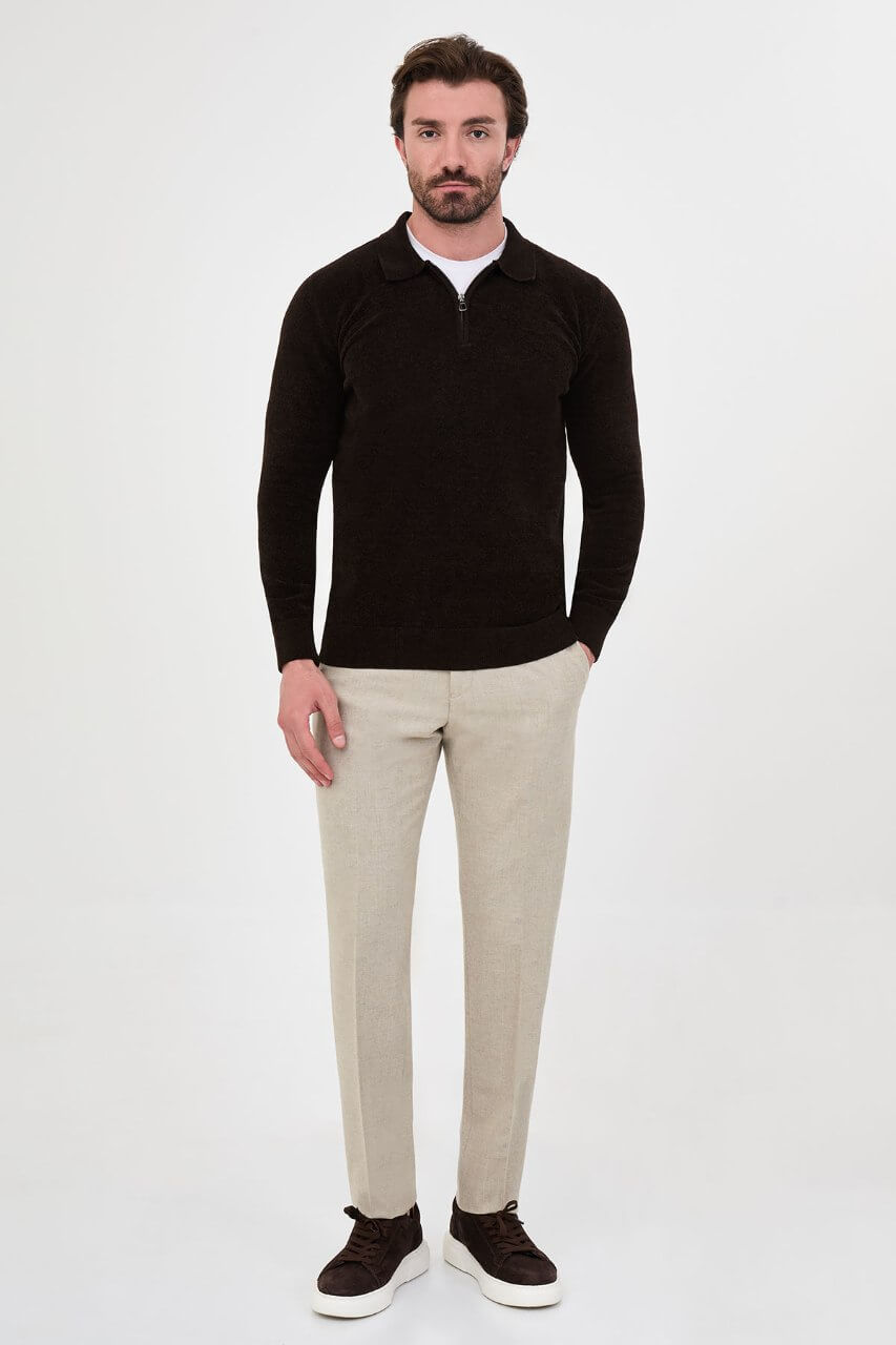 Men’s brown polo neck knit sweater with zip collar detail styled with cream trousers for a smart casual fall winter outfit.