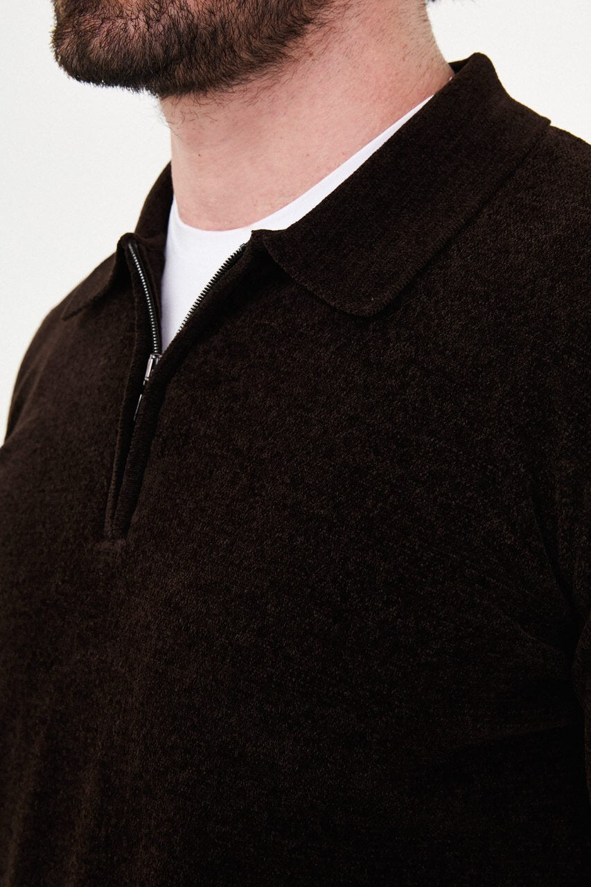 Men’s brown polo neck knit sweater with zip collar detail styled with cream trousers for a smart casual fall winter outfit.