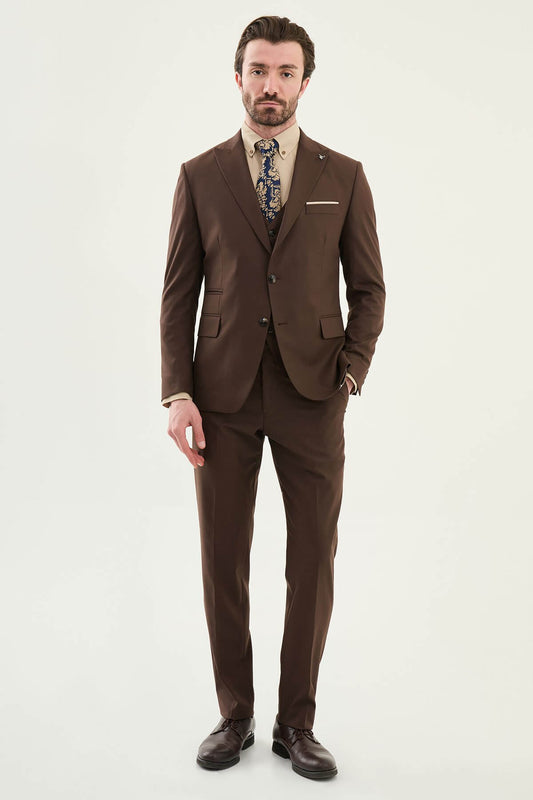 Brown 3 piece suit with matching waistcoat, beige shirt and patterned tie, front view