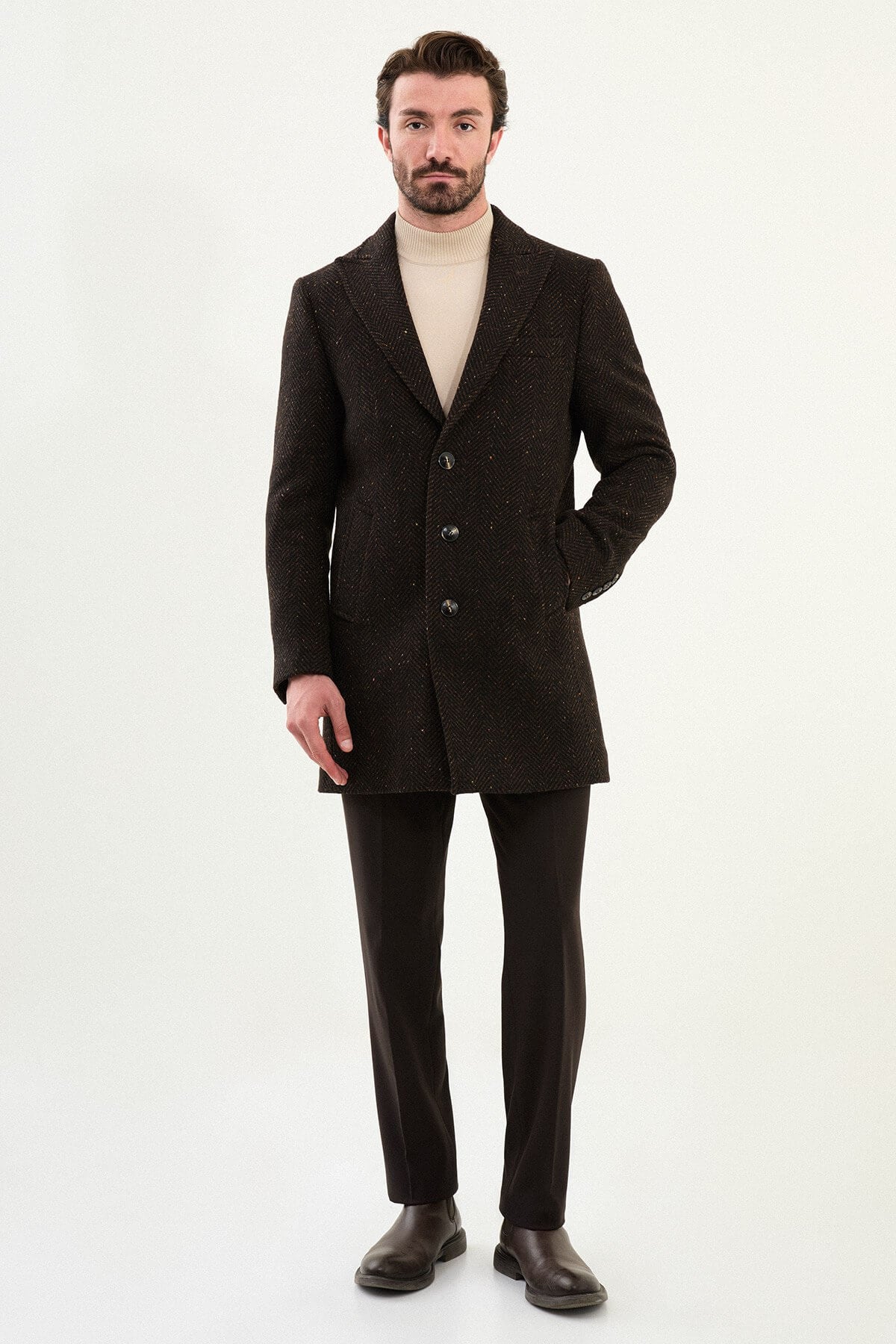 Brown wool blend tailored coat styled with beige turtleneck sweater. 