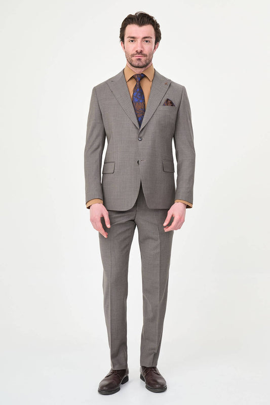 man in a Brown Slim Fit Wide Collar Premium Wool Suit, highlighting the slim-fit trousers and polished dress shoes.