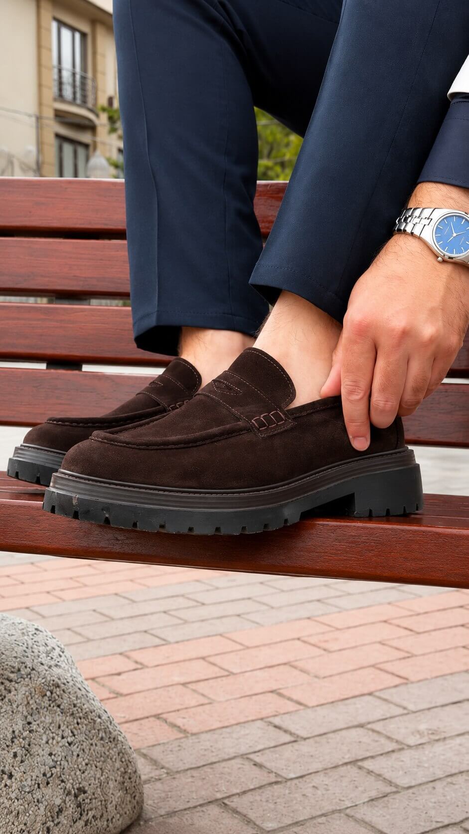 Brown suede penny loafer for men, top view of penny strap and vamp