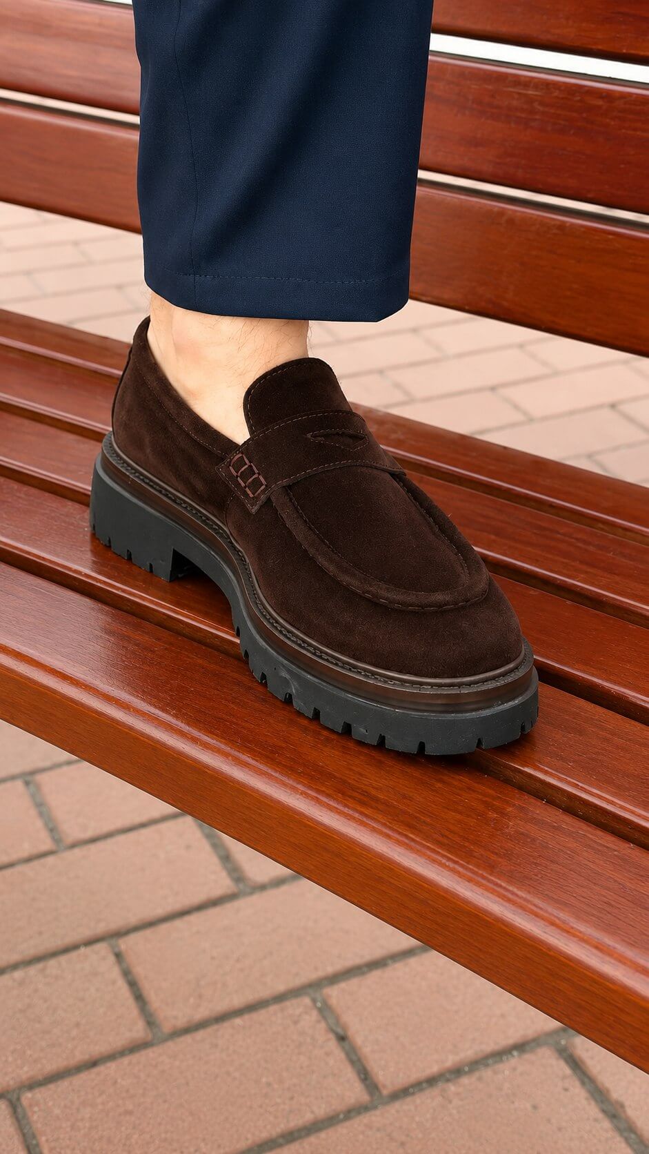 Men's brown suede penny loafer, angled heel and profile view
