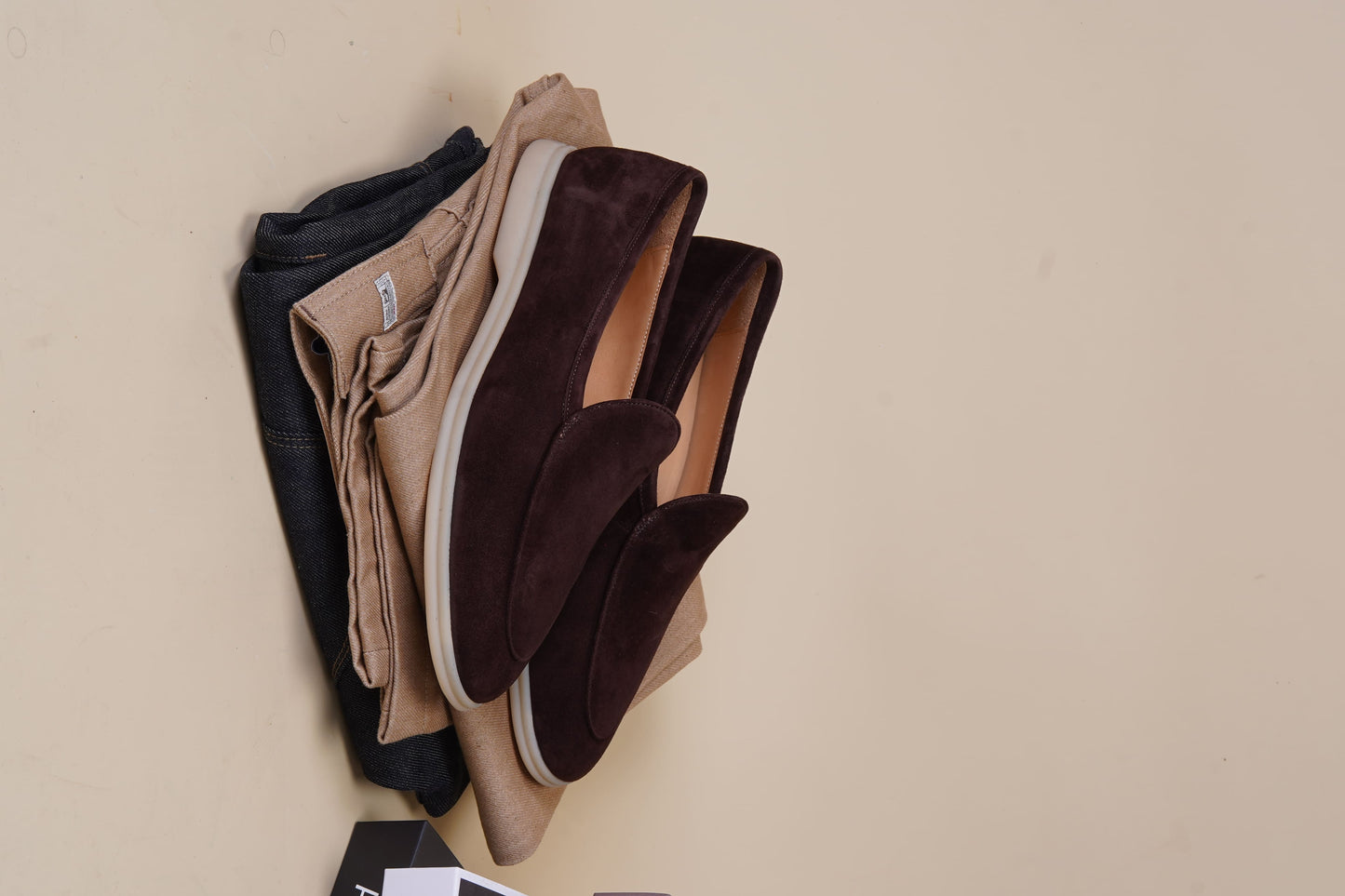 Men’s brown suede slip-on loafers with minimalist apron design and cream sole, perfect for smart-casual summer outfits.