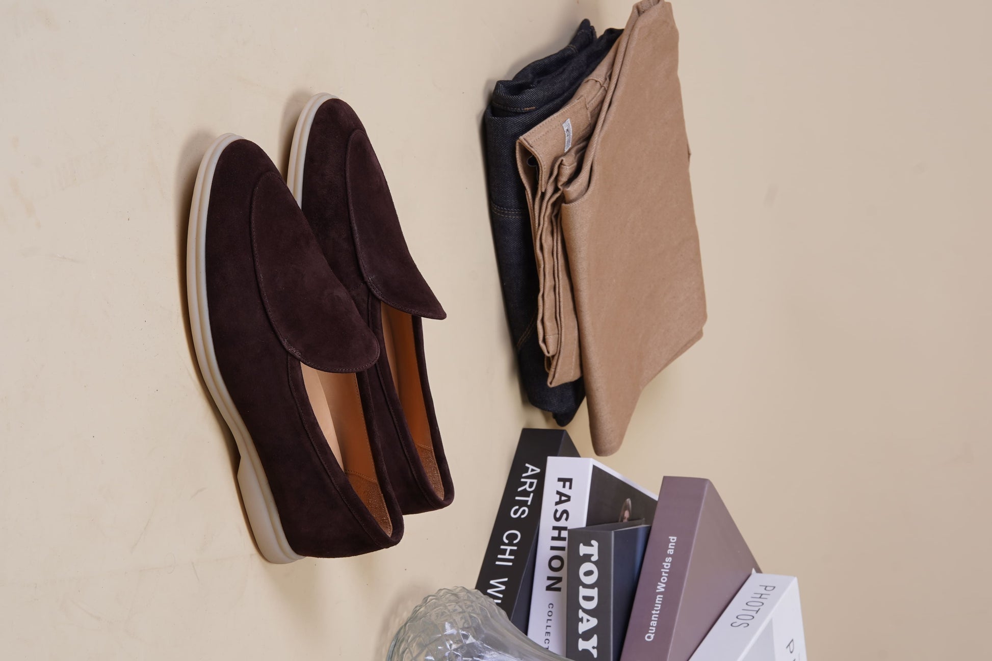Men’s brown suede slip-on loafers with minimalist apron design and cream sole, perfect for smart-casual summer outfits.