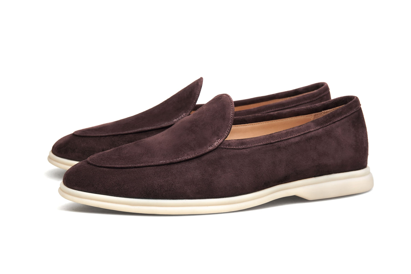 Men’s brown suede slip-on loafers with minimalist apron design and cream sole, perfect for smart-casual summer outfits.