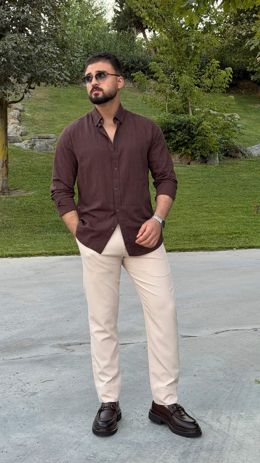 Men’s brown textured cotton long sleeve casual shirt styled with cream trousers and loafers