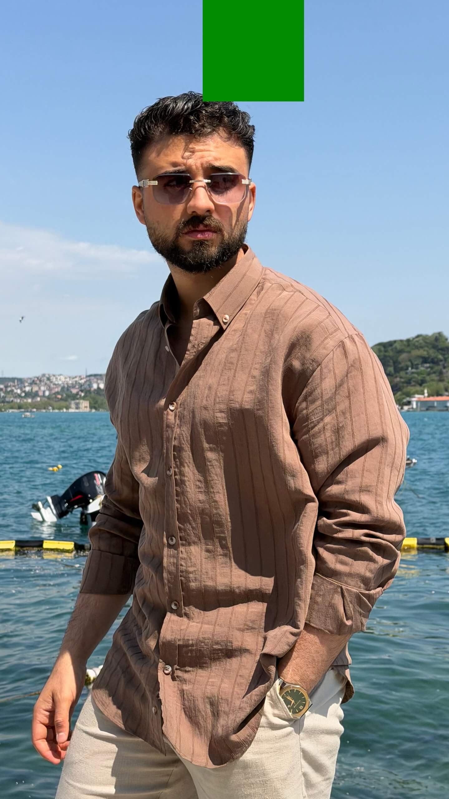Brown vertical-striped men's linen-look shirt in relaxed fit, front view