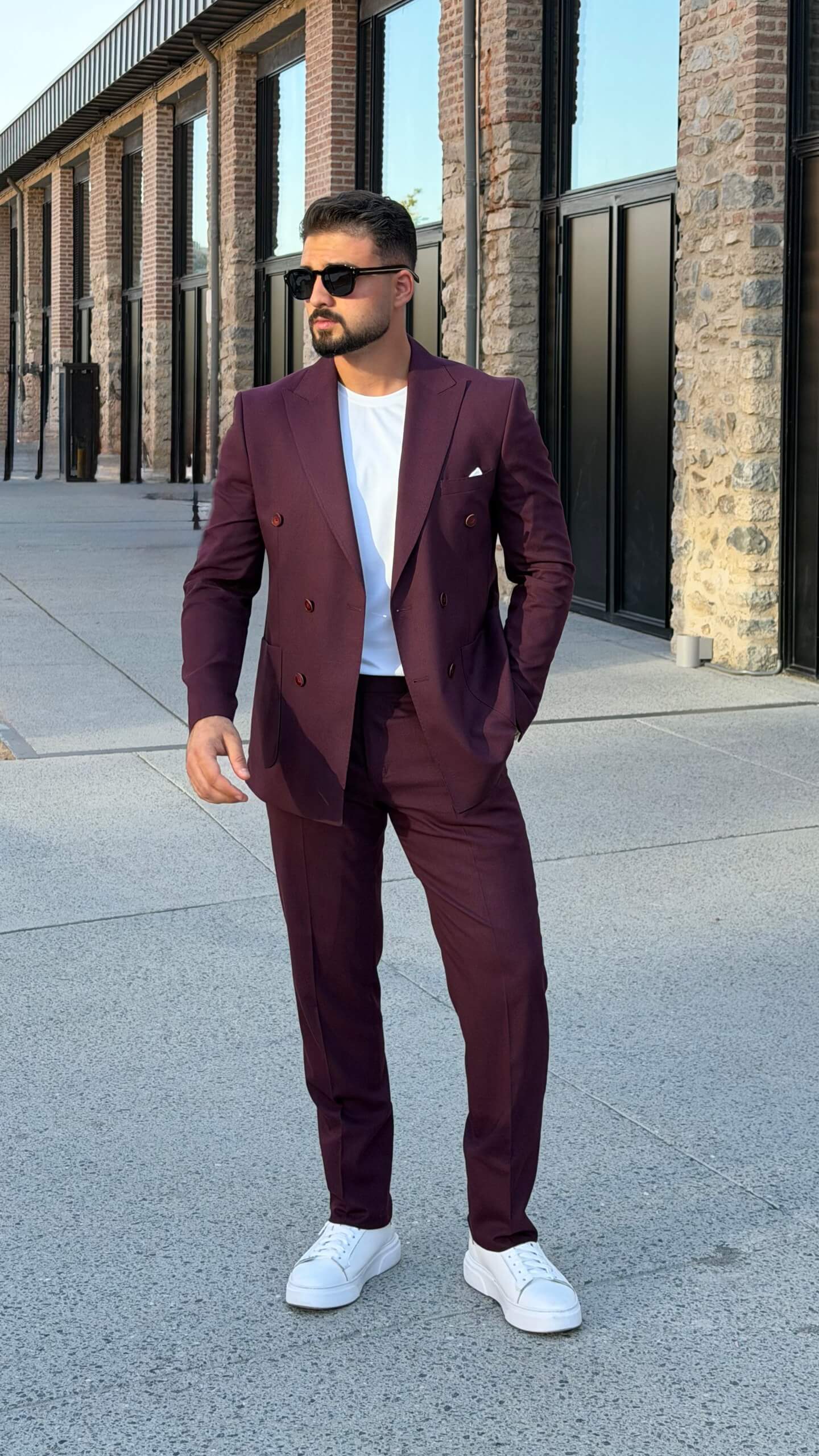 Men’s burgundy double breasted suit styled with white T-shirt for modern smart casual fashion