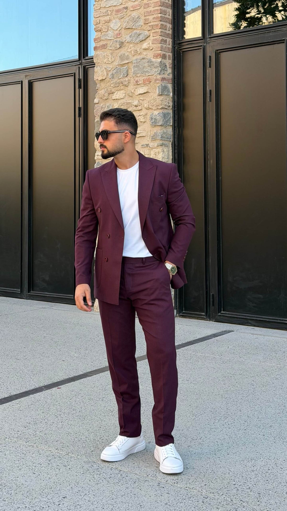 Men’s burgundy double breasted suit styled with white T-shirt for modern smart casual fashion