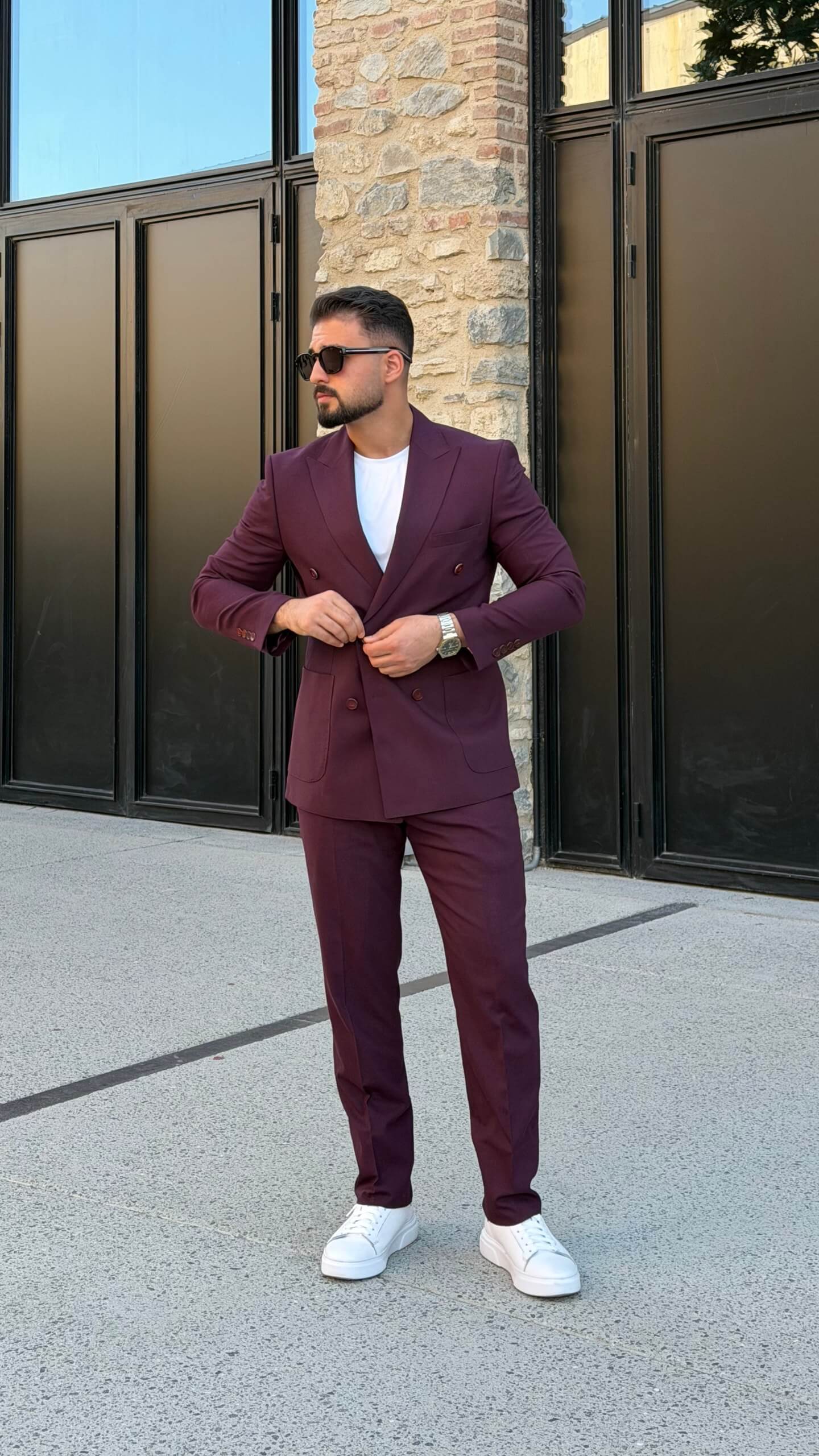 Men’s burgundy double breasted suit styled with white T-shirt for modern smart casual fashion