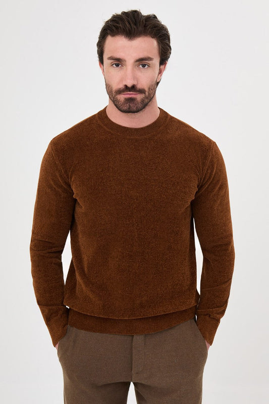 Men’s camel crew neck knit sweater in a cotton blend slim fit design styled with brown trousers for a refined fall winter outfit.