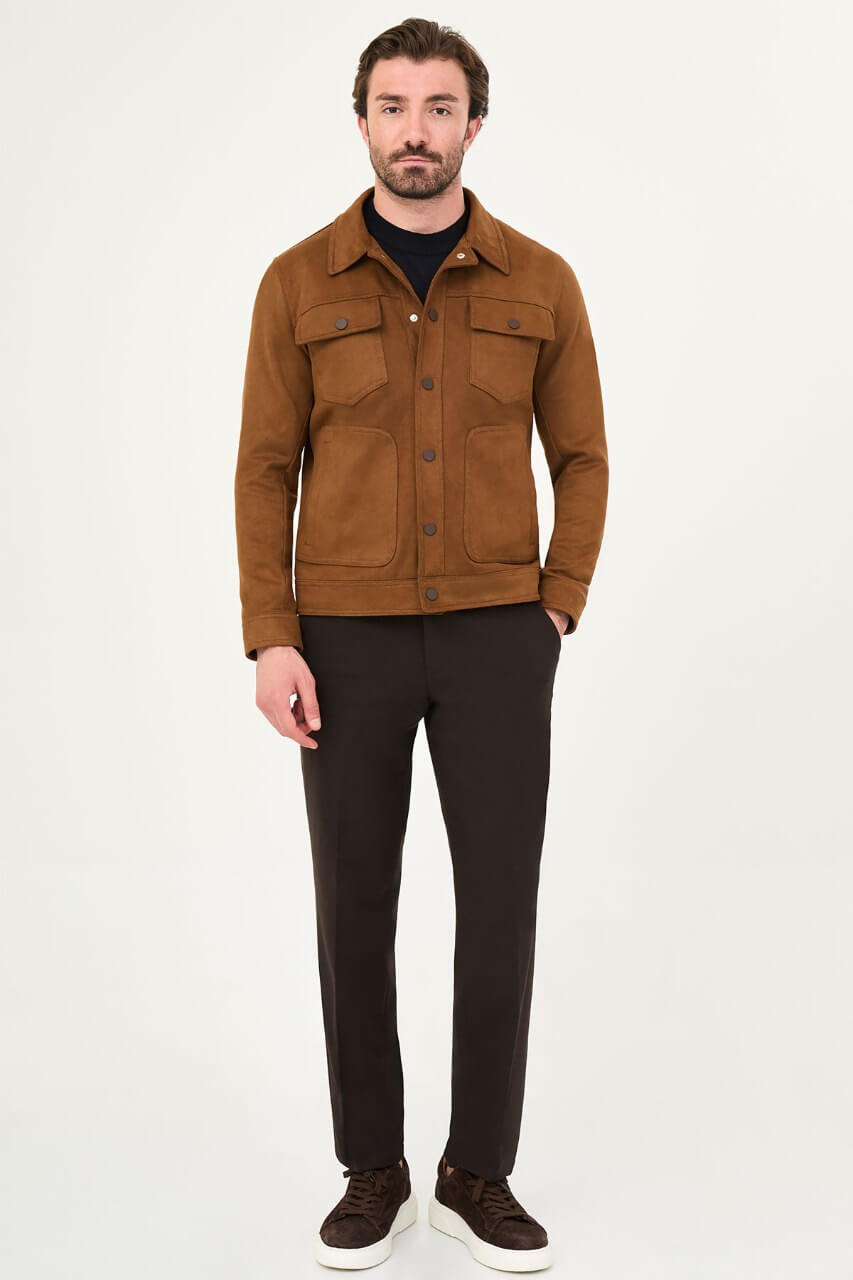 Men's camel suede-style jacket styled with a black sweater and dark trousers.